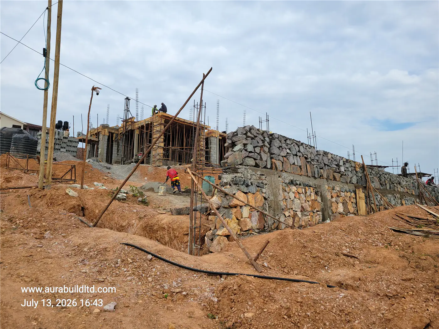 Masonry retaining wall and timber formwork for the first floor slab at Nsasa-Kira